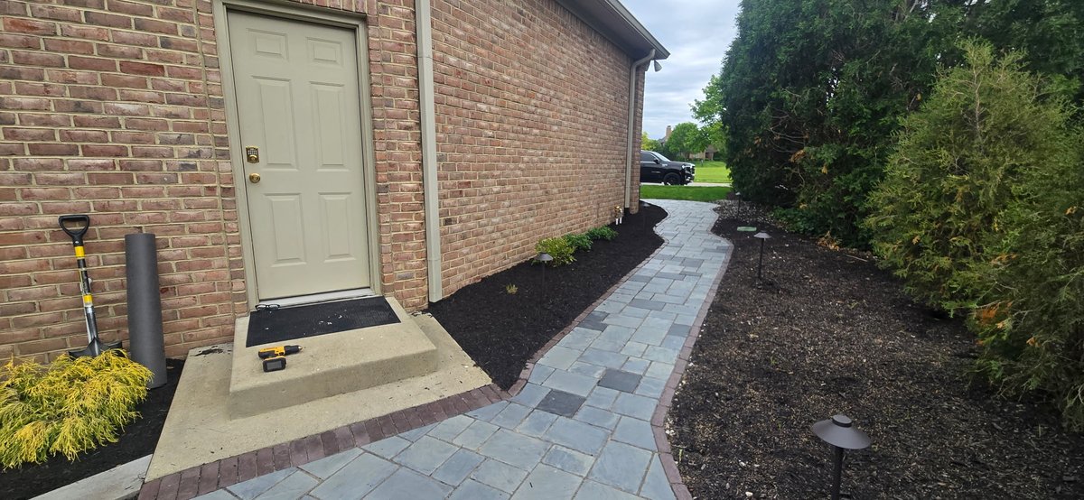 Paver walkway with landscape lighting
