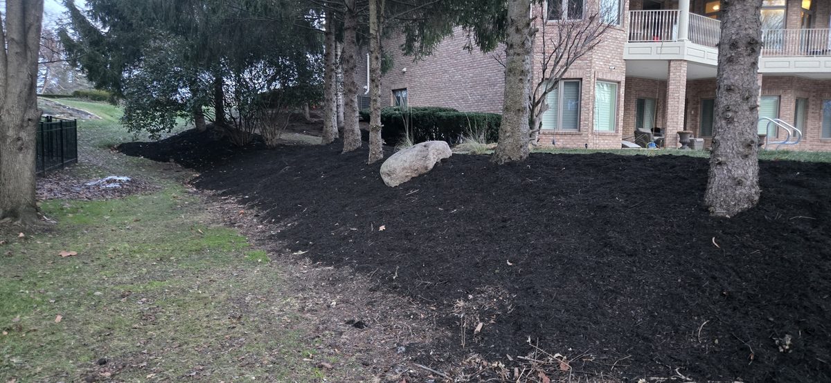 Large boulder retaining wall installation