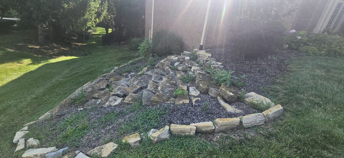 Natural stone rock bed garden installation