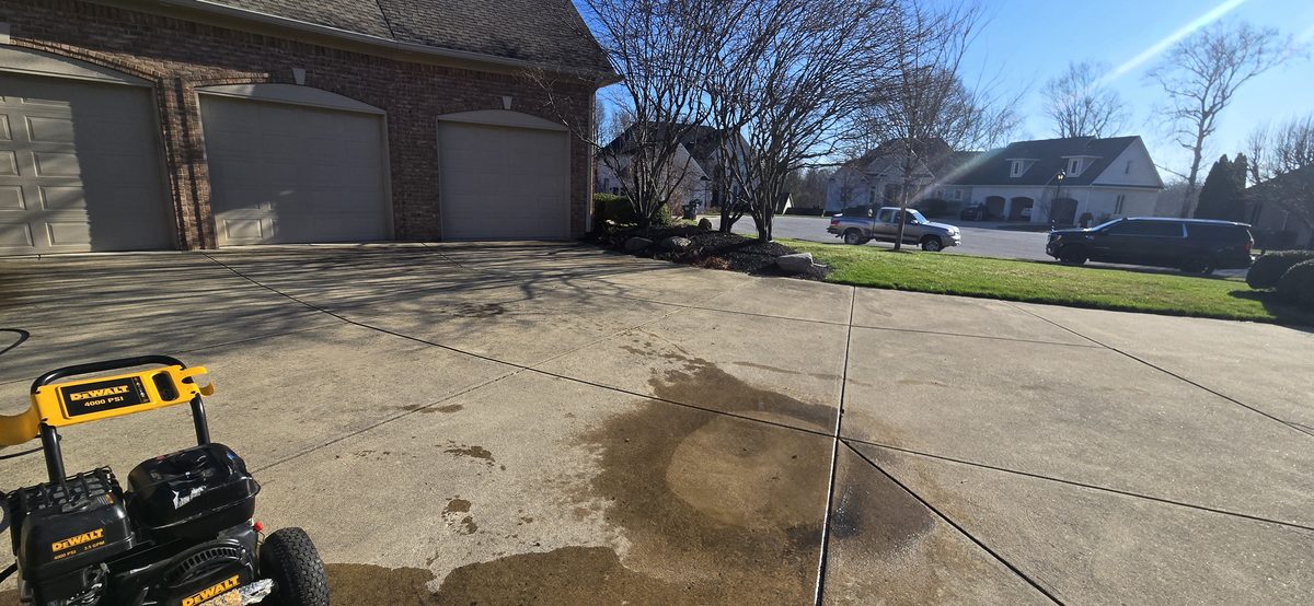 Driveway power washing in progress