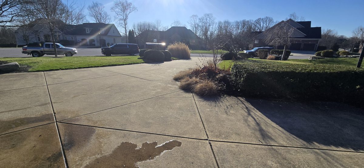 Driveway power washing in progress