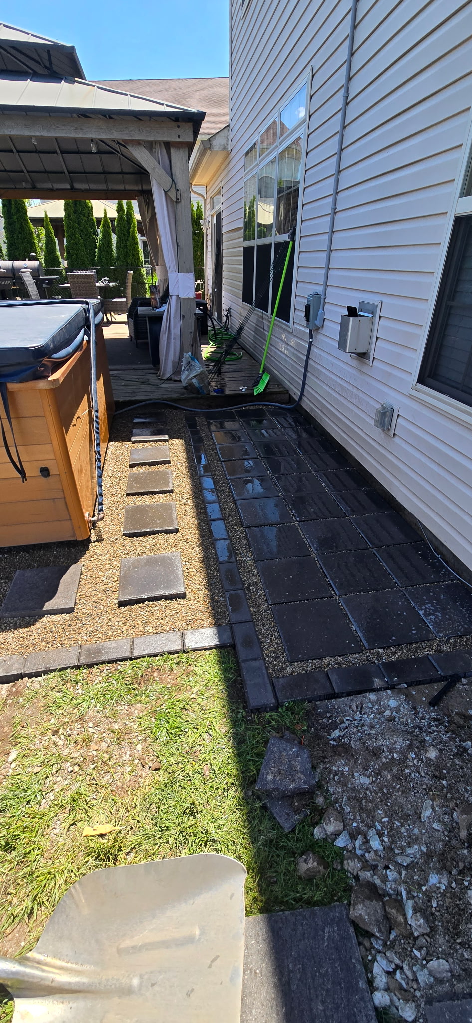Paver walkway with stepping stones alongside house