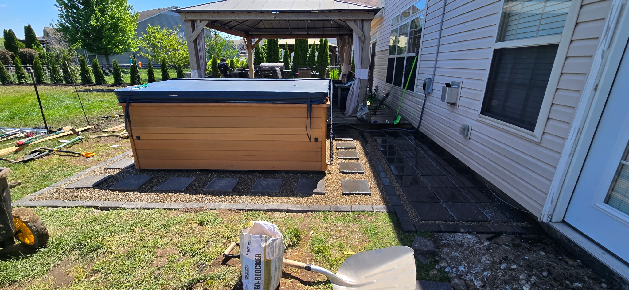 Paver patio installation with hot tub and gazebo — DNA Prime