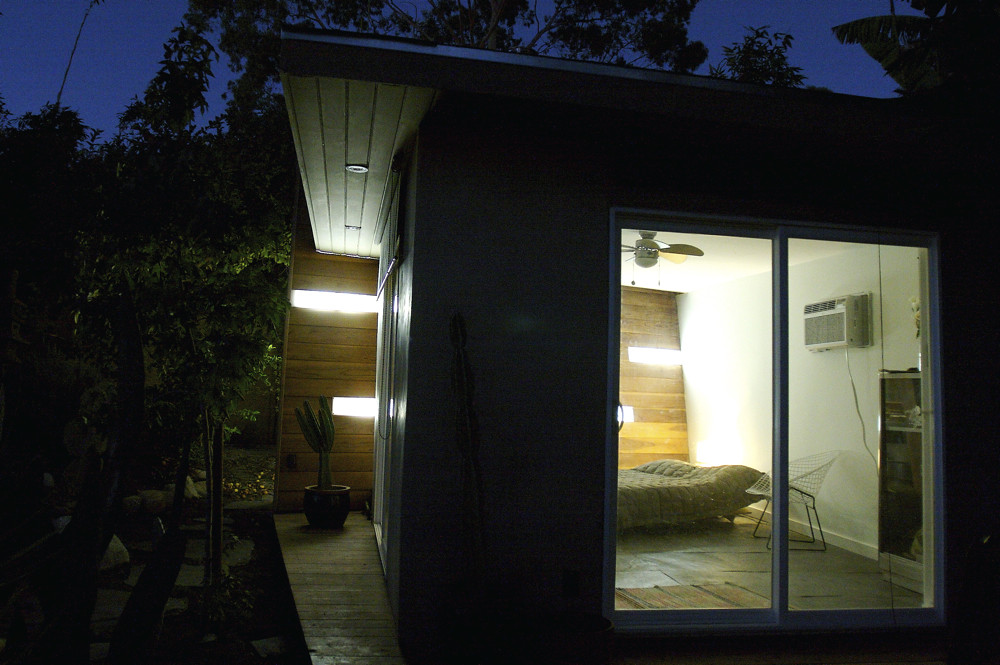 Home exterior lit at night with permanent lighting in Greenwood, IN